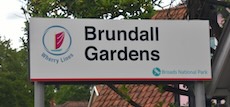 Brundall Gardens station sign